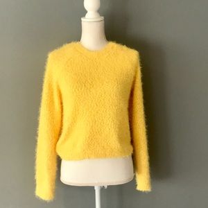 fluffy yellow sweater